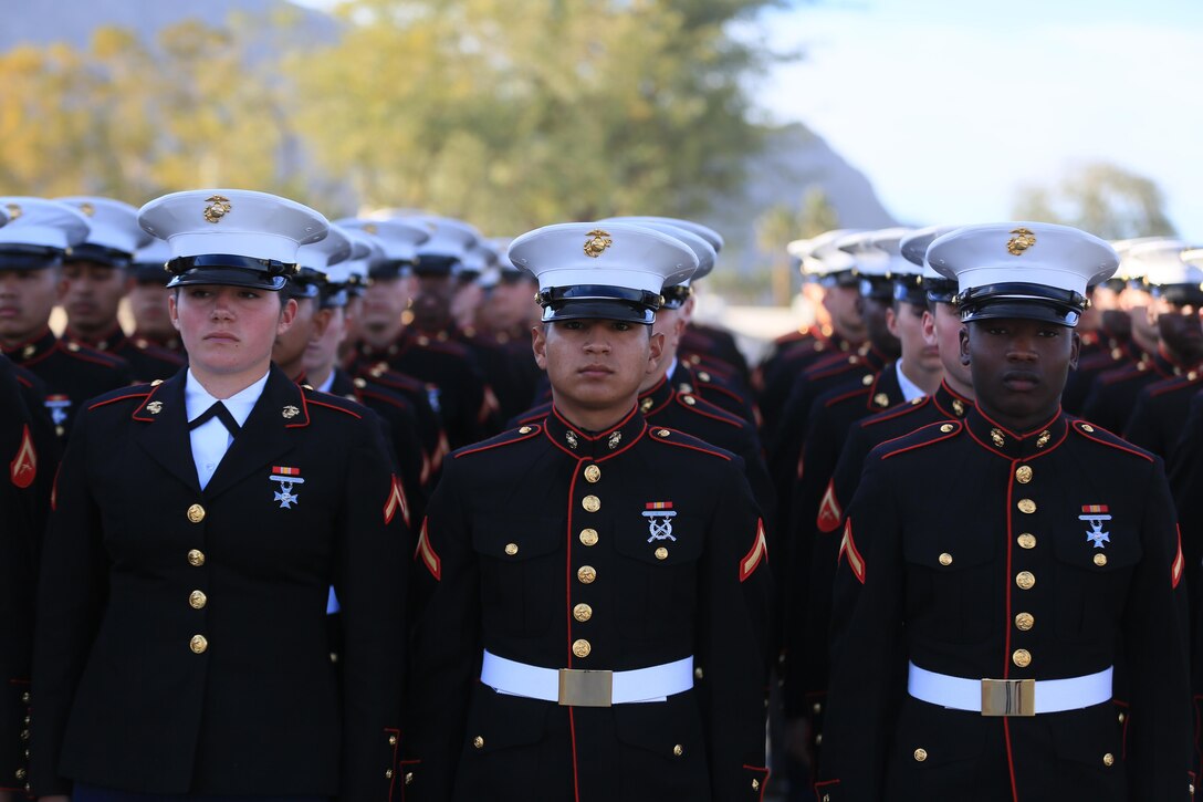 Marine Corps Communication-Electronics School students prepare to march during the Career Builder Challenge Military Appreciation Ceremony at the Tom Weiskopf Private Course located in the Professional Golfers Association of America Course West in La Quinta, Calif., Jan. 23, 2016. More than 50 MCCES Marines marched in formation during the event. (Official Marine Corps photo by Cpl. Julio McGraw/Released)