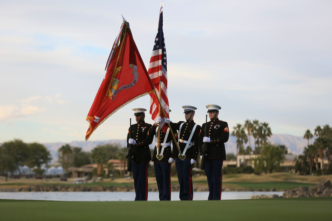 The 3rd Light Armored Reconnaissance Battalion Color Guard presents the national colors during the playing of ‘The Star-Spangled Banner’ during the Career Builder Challenge Military Appreciation Ceremony at the Tom Weiskopf Private Course located in the Professional Golfers Association of America Course West in La Quinta, Calif., Jan. 23, 2016. (Official Marine Corps photo by Cpl. Julio McGraw/Released)