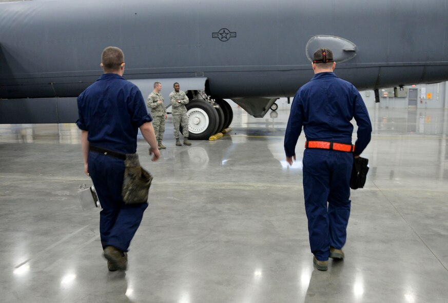 Weapons load crew team members from the 96th Aircraft Maintenance Unit, inspect a B-52 Stratofortress before competing in the weapons load finals at Barksdale Air Force Base, La., Jan. 21, 2016. Teams needed to ensure that the aircraft didn’t have any discrepancies that could prevent the crew from loading munitions on the aircraft. (U.S. Air Force photo/Senior Airman Amanda Morris)
