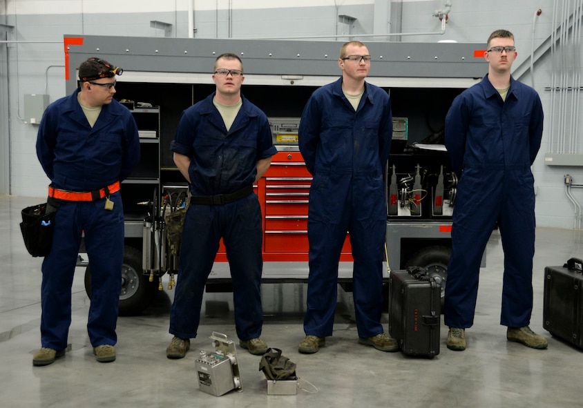 The 96th Aircraft Maintenance Unit weapons load crew team waits for the timer to start before competing in the weapons load finals at Barksdale Air Force Base, La., Jan. 21, 2016. One crew from the 96th AMU and 20th Aircraft Maintenance Unit were selected to participate based on their quarterly weapons loading evaluation stats and stellar aircraft maintenance actions. (U.S. Air Force photo/Senior Airman Amanda Morris)