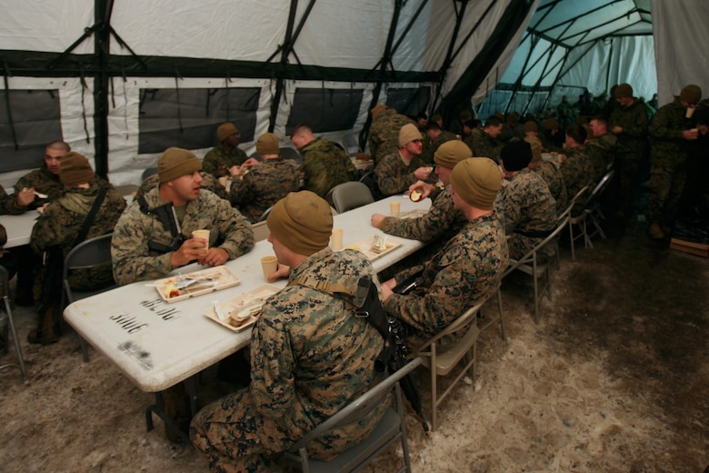 Marines enjoy a meal inside the field mess tent during cold weather training at the Marine Corps Mountain Warfare Training Center, Calif., Jan. 10, 2015. Hundreds of Marines participated in the cold weather training, enduring freezing temperatures during the two-week-long exercise in the Sierra Mountains. (U.S. Marine Corps photo by Cpl. Jason Jimenez/Released)