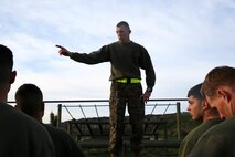 Staff Sgt. James Case, the chief instructor of the Headquarters Battalion, 1st Marine Division Lance Corporal Seminar Leadership and Ethics Seminar, briefs students on the plan of the day after a combat conditioning session aboard Marine Corps Base Camp Pendleton, Calif., Jan. 27, 2016. The weeklong seminar focuses on preparing lance corporals physically and mentally to become successful noncommissioned officers, while building the foundation for the more difficult residential courses like Corporals Course and Sergeants Course.