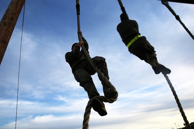 Marines with Headquarters Battalion, 1st Marine Division climb ropes during a Lance Corporal Leadership and Ethics Seminar combat conditioning session aboard Marine Corps Base Camp Pendleton, Calif., Jan. 27, 2016. The week-long seminar focuses on preparing lance corporals physically and mentally to become successful noncommissioned officers, while building the foundation for the more difficult residential courses like Corporals Course and Sergeants Course.