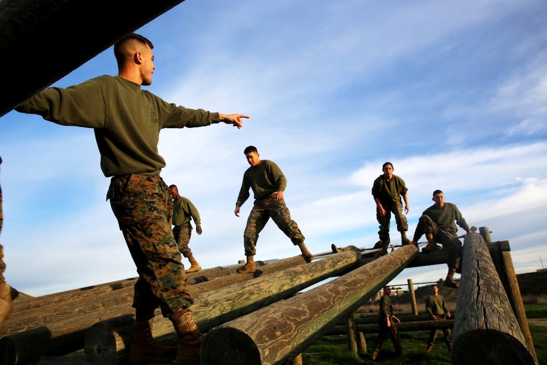 Students work together to navigate the obstacle course during a Headquarters Battalion, 1st Marine Division Lance Corporal Leadership and Ethics Seminar combat conditioning session aboard Marine Corps Base Camp Pendleton, Calif., Jan. 27, 2016. The week-long seminar focuses on preparing lance corporals physically and mentally to become successful noncommissioned officers, while building the foundation for the more difficult residential courses like Corporals Course and Sergeants Course.