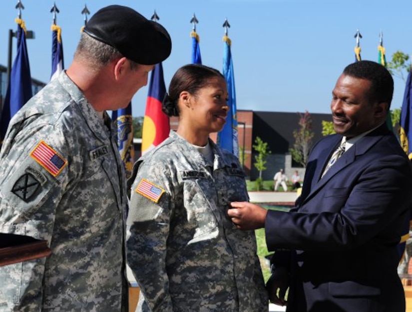 Maj. Gen. Marcia M. Anderson receives her second star from husband Amos during a Sept. 29 ceremony at Fort Knox, Ky. The U.S. Army Accessions Command and Fort Knox commanding general, Lt. Gen. Benjamin Freakley (at left), watches the pinning of the two-star rank. Anderson, deputy commanding general of the U.S. Army Human Resources Command, is the first-ever female U.S. Army African-American officer to obtain the rank of major general. (Photo Credit: Sally Harding, Ft Knox VI)