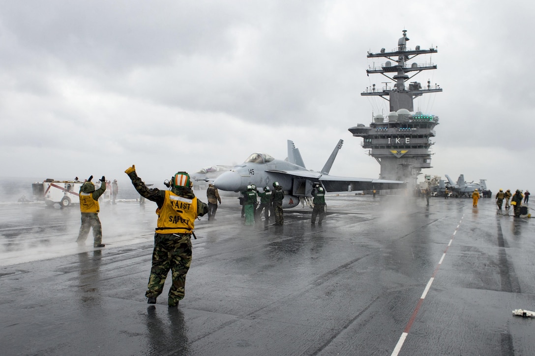 Sailors perform preflight checks on an F/A-18E Super Hornet on the aircraft carrier USS Dwight D. Eisenhower in the Atlantic Ocean, Jan. 27, 2016. The Eisenhower is preparing for upcoming inspections and conducting carrier qualifications. Navy photo by Petty Officer 3rd Class Anderson W. Branch