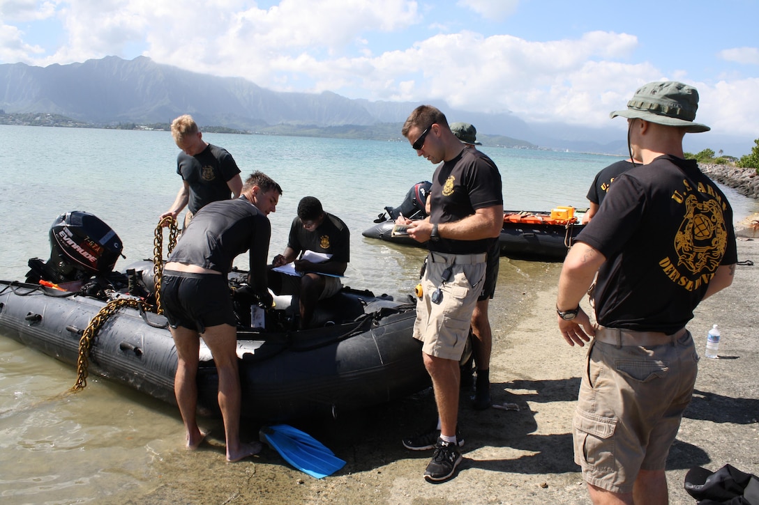 MARINE CORPS BASE HAWAII (Jan. 26, 2016) -- Divers from the  U.S. Army’s 7th Dive Detachment ready their dive gear and rib boat before heading out into the waters of Kaneohe Bay to conduct a dive survey for the U.S. Army Corps of Engineers, Honolulu District in support of a Navy Dept. financed structural study of the historic Seaplane Ramps at Marine Corps Base Hawaii (MCBH) on Kaneohe Bay. The study, being conducted in-house by the District, provided an opportunity for the Corps to partner with the Army’s 7th Dive Detachment, 84th Engineer Battalion, 130th Engineer Brigade, which conducted the two day underwater site survey this week. 