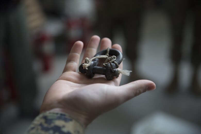 Marines with Marine Aerial Refueler Transport Squadron (VMGR) 152 at Marine Corps Air Station Iwakuni, Japan, pass around G-14 Clevises during familiarization training on air drop kits Jan. 26, 2016. Air drop kits hold equipment needed to effectively and safely conduct an air drop out of a KC-130 Super Hercules. This hands-on training helped refresh and explain nomenclature and uses of each piece of equipment in the kit to the crew masters and students.
