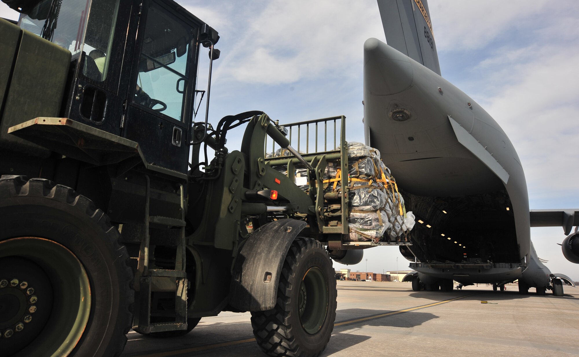A C-17 Globemaster III aircraft assigned to the 437th Airlift Wing, at Joint Base Charleston, S.C., is loaded with equipment at Whiteman Air Force Base, Mo., Jan. 24, 2016 in preparation for a joint combat search and rescue exercise. The multi-week exercise incorporates Airmen from multiple squadrons and Air Force bases including Whiteman AFB, Patrick AFB, Fla., and Joint-Base Charleston. (U.S. Air Force Photo by Airman 1st Class Jovan Banks)