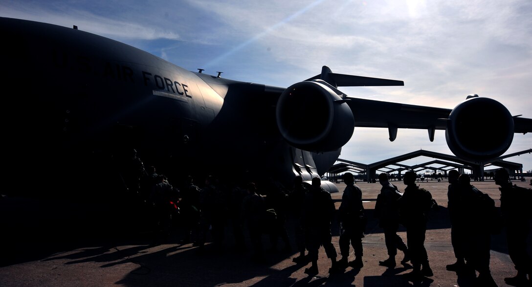 Members of the 442d Fighter Wing board a C-17 Globemaster III aircraft at Whiteman Air Force Base, Mo., Jan. 24, 2016. More than 80 Airmen boarded the C-17 assigned to the 437th Airlift Wing, at Joint Base Charleston, S.C., in preparation for a multi-week combat search and rescue exercise. (U.S. Air Force photo by Airman 1st Class Jovan Banks)