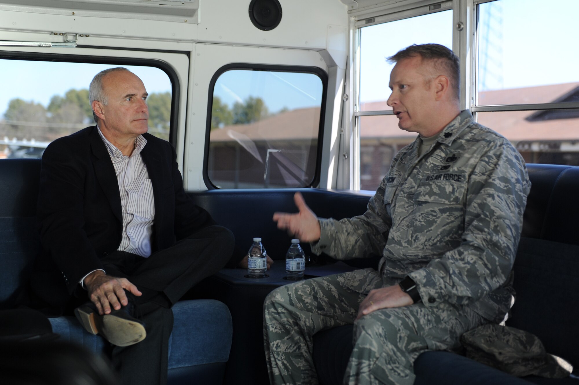 U.S. Air Force Lt. Col Frank Marconi, 19th Mission Support Group deputy commander, talks to Daniel McMillin, Auditor General of the Air Force, about the base activities, during a windshield tour, January 28, 2016, at Little Rock Air Force Base, Arkansas. McMillin visited the Airman and Family Readiness Center on base.