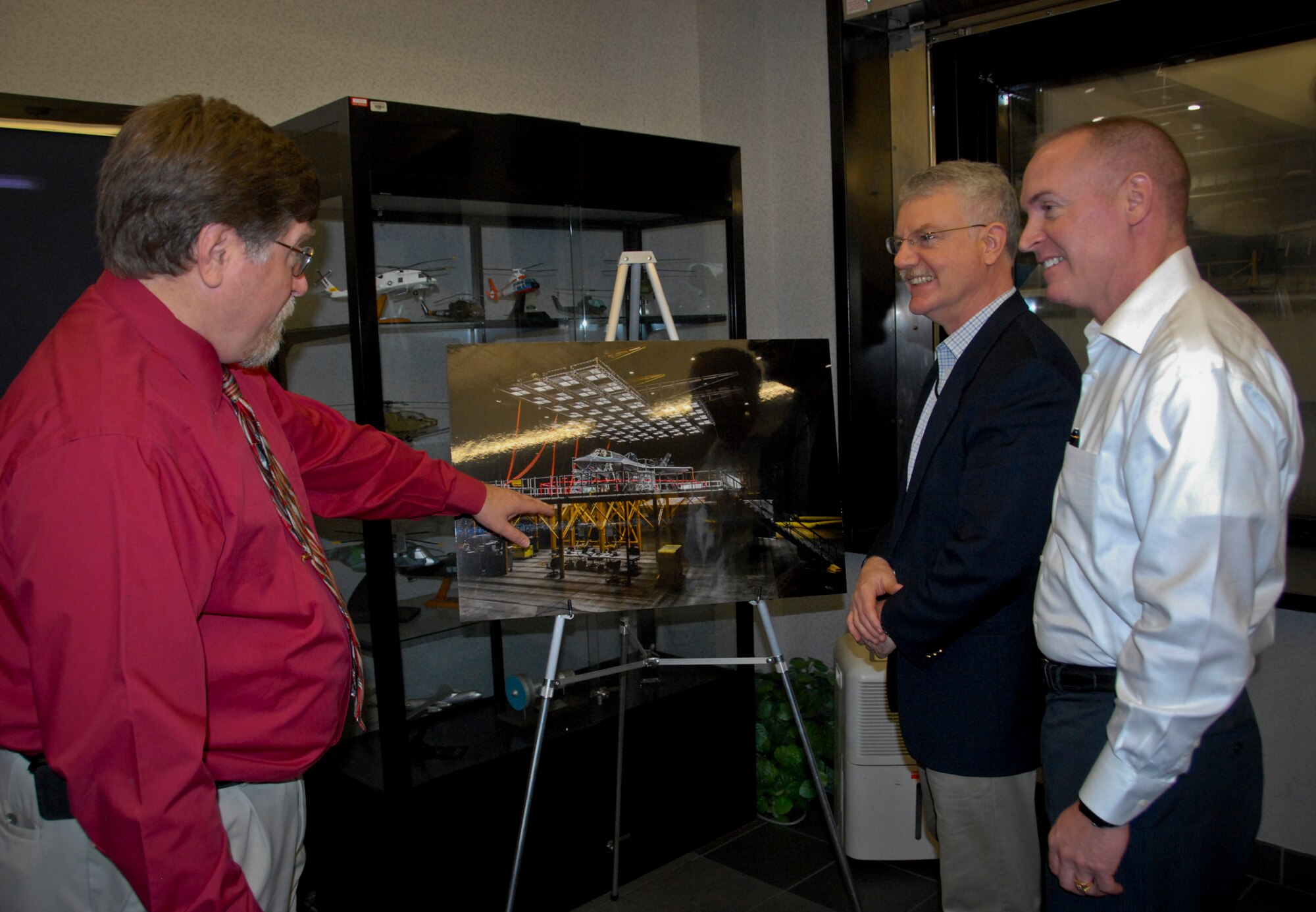 David Robertson, Air Force Test Center; and Dr. Todd Fore, Air Force Materiel Command, receive a briefing from Dwayne Bell, McKinley Climatic Lab chief, during a tour of Eglin Air Force Base Jan. 24-28. They received immersion briefings and presentations about the diverse and complex missions located on one of DoD’s largest military installations.  Fore and Robertson participated in the AFMC and American Federation of Government Employees Council 214 Partnership meeting held this week as well.  Their visit came just after the Commander-in-Chief Installation Award team visit, considering Eglin as one of two finalists for the prestigious DoD program.  (U.S Air Force photo/Kevin Gaddie)  
