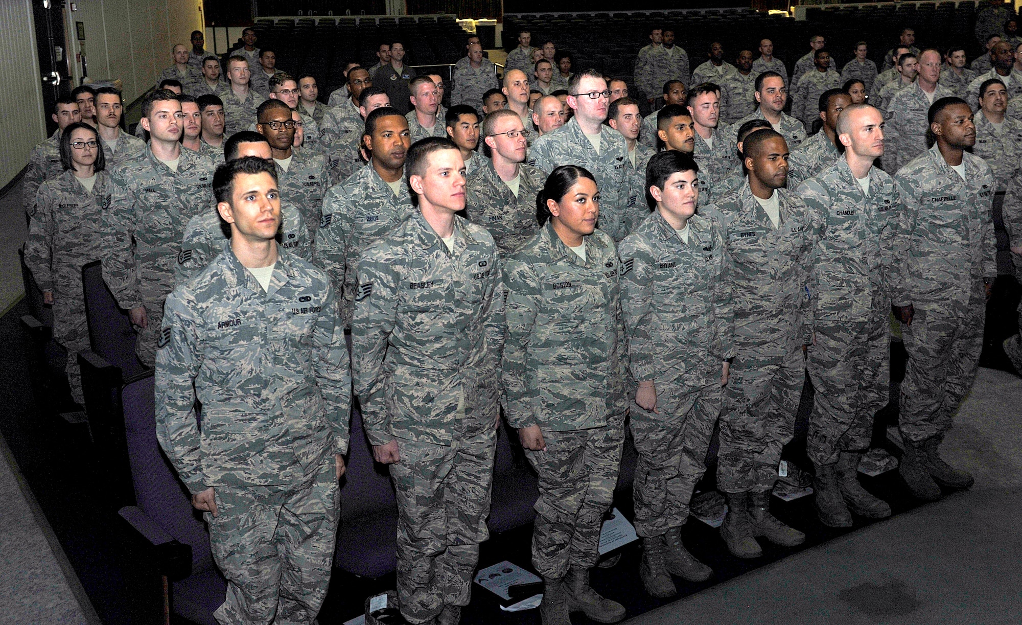 Newly promoted staff sergeants stand at attention during a quarterly NCO induction ceremony Jan. 28, 2016, at Kadena Air Base, Japan. Team Kadena recognized this momentous occasion for these new NCOs as they step into the next stage of their careers. (U.S. Air Force photo by Naoto Anazawa)

