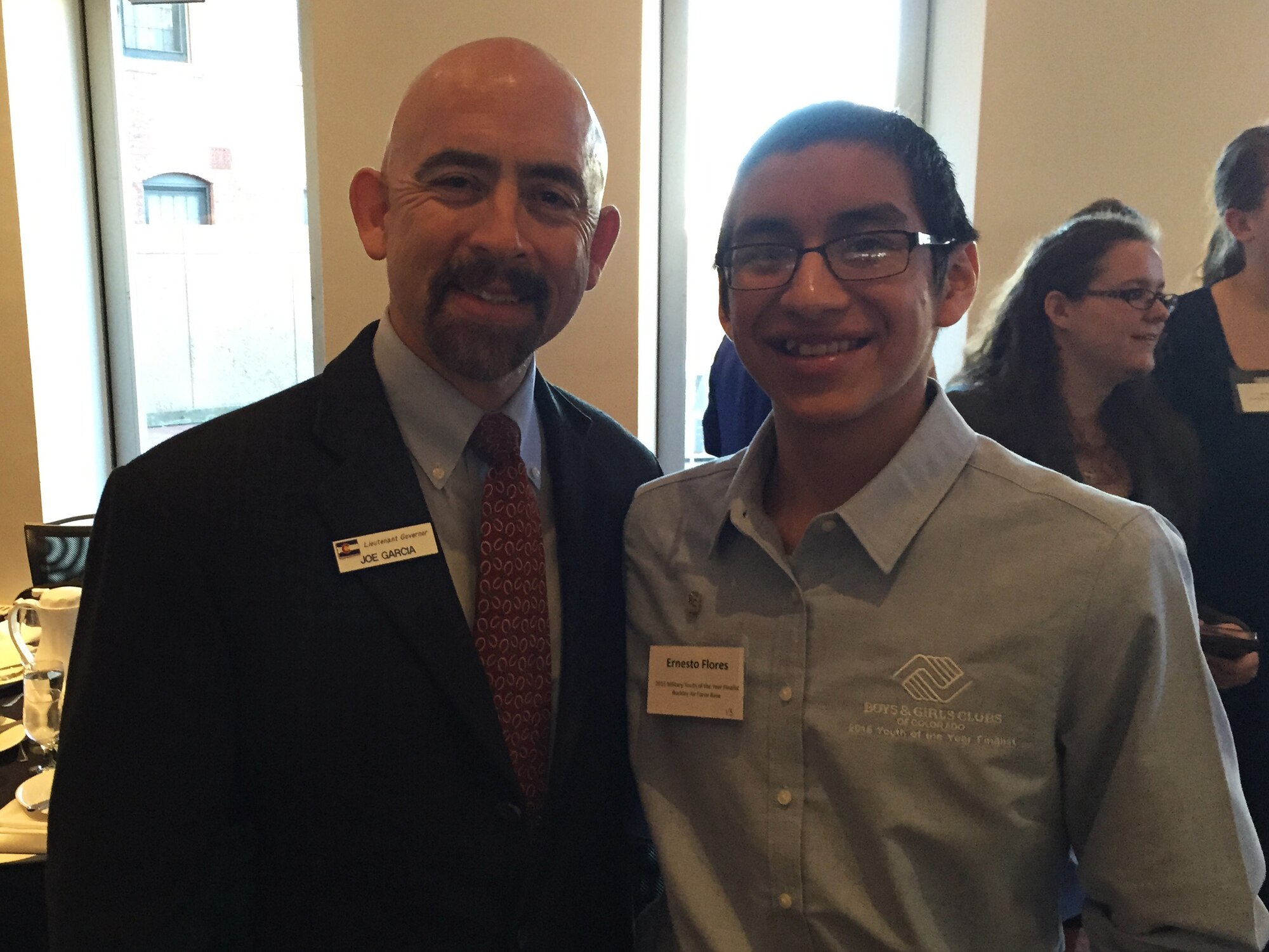Ernesto Flores, Buckley Air Force Base Youth of the Year, Colo., stands beside Joe Garcia, Lieutenant Governor of Colorado, during a Youth of the Year event, March 24, 2015. The program recognized outstanding teens in the community who embody academic excellence, healthy lifestyles, values of leadership and service to the community. (courtesy photo)
