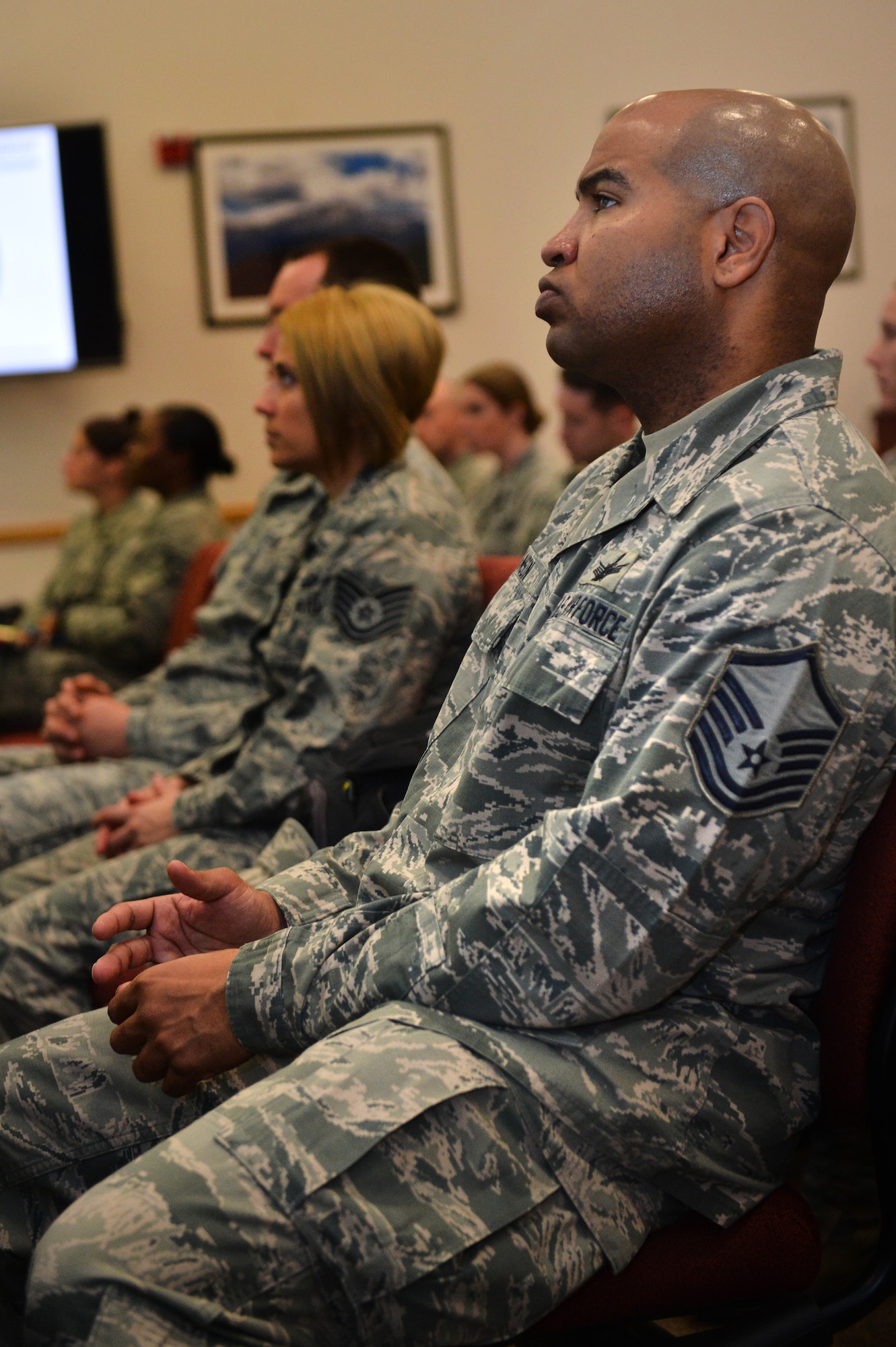 Team Buckley officers and enlisted members learn about the new Buckley Mentoring Program during a kickoff event Jan. 28, 2016, on Buckley Air Force Base, Colo. The new program matches applicants with a mentor who can best assist them and is open to all Team Buckley members. (U.S. Air Force photo by Staff Sgt. Darren Scott/Released)