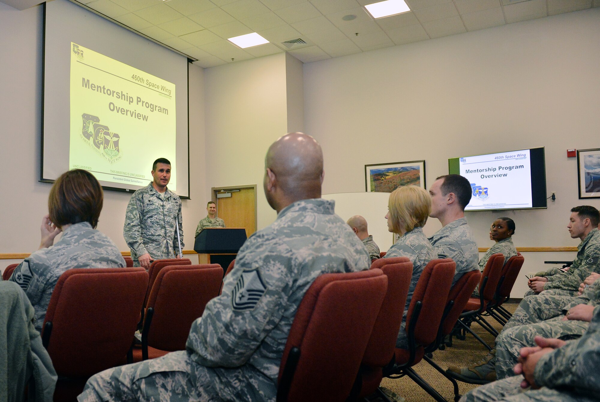 Col. John Wagner, 460th Space Wing commander, speaks to Team Buckley members about a new mentorship program during a kickoff event Jan. 28, 2016, on Buckley Air Force Base, Colo. The Buckley Mentoring Program, which is overseen by the 460th Space Wing command chief, matches applicants with a mentor who can best assist them and is open to all Team Buckley members. (U.S. Air Force photo by Staff Sgt. Darren Scott/Released)