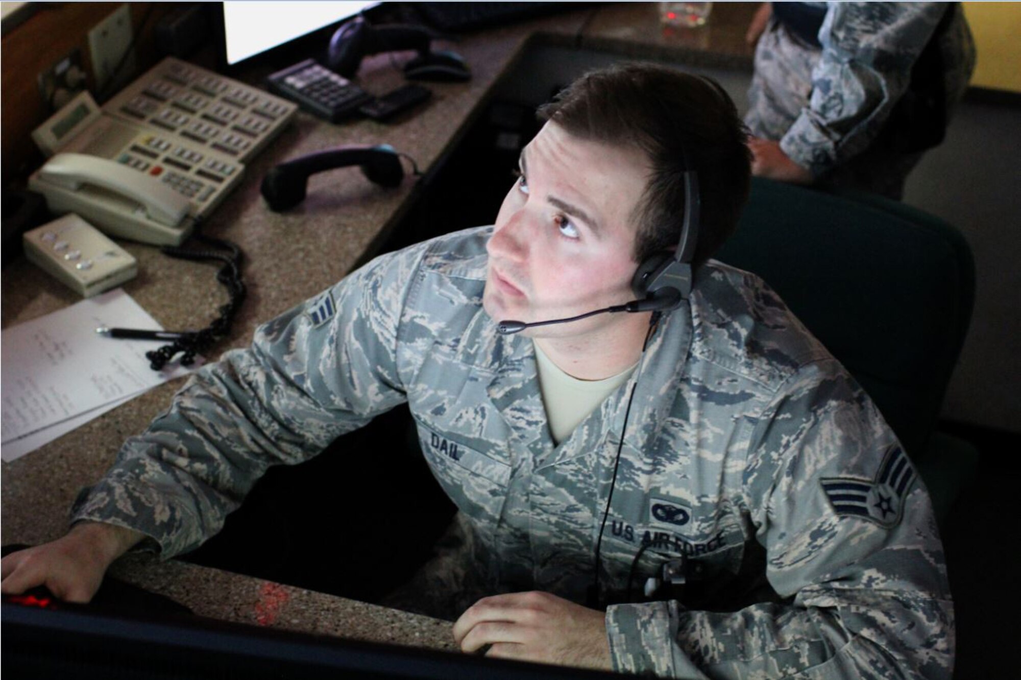 Senior Airman Nathan Dail, a 377th Security Forces Squadron base defense operations center controller, monitors base cameras for abnormal activities, Kirtland Air Force Base, New Mexico, Jan. 25, 2016. The BDOC is the command and control element for security at Kirtland and is critical to force protection. (Photo by Master Sgt. Phyllis Keith)
