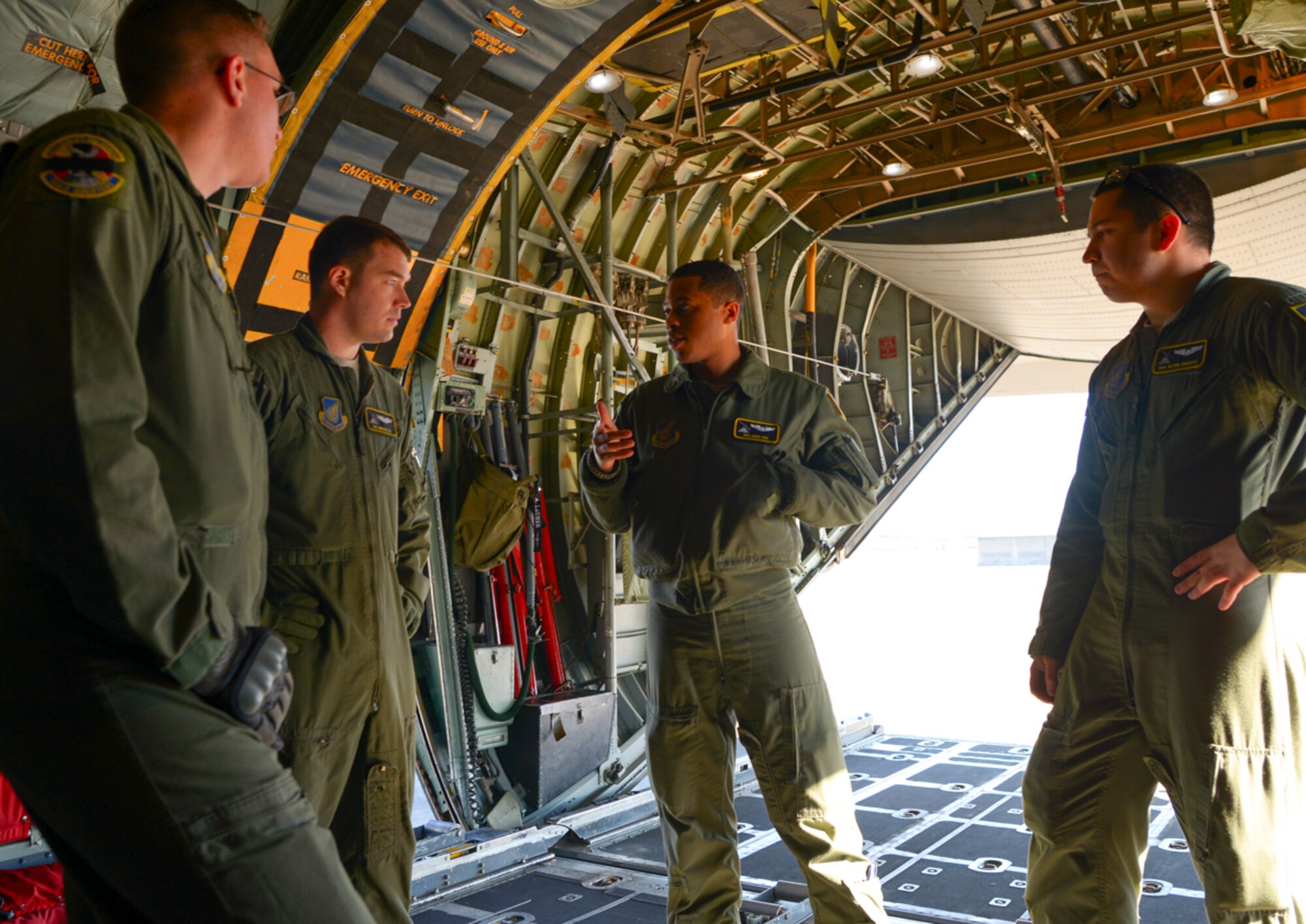 Loadmasters with the 36th Airlift Squadron conduct a pre-mission briefing at Yokota Air Base, Japan Jan. 25, 2016. The crew performed high-altitude personnel drops as part of regular training to keep all related personnel prepared to respond to real-world contingencies. (U.S. Air Force photo by Airman 1st Class Elizabeth Baker/Released)
