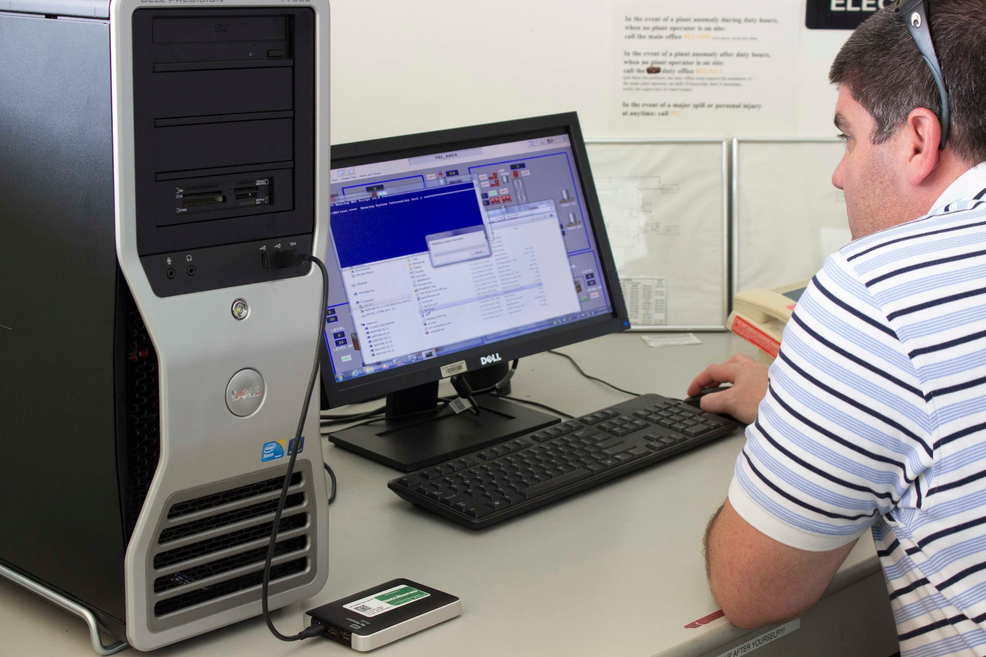 Derek Cope, an information assurance analyst for the Air Force Civil Engineer Center’s civil engineer maintenance inspection and repair team, runs computer scans to collect system information from the energy management control system at Patrick Air Force Base, Florida. The CEMIRT ICS risk assessment team works with base civil engineers at each base assessed to find various risk aversion opportunities to secure civil engineer industrial control systems. (U.S. Air Force Photo/Susan Lawson/Released)