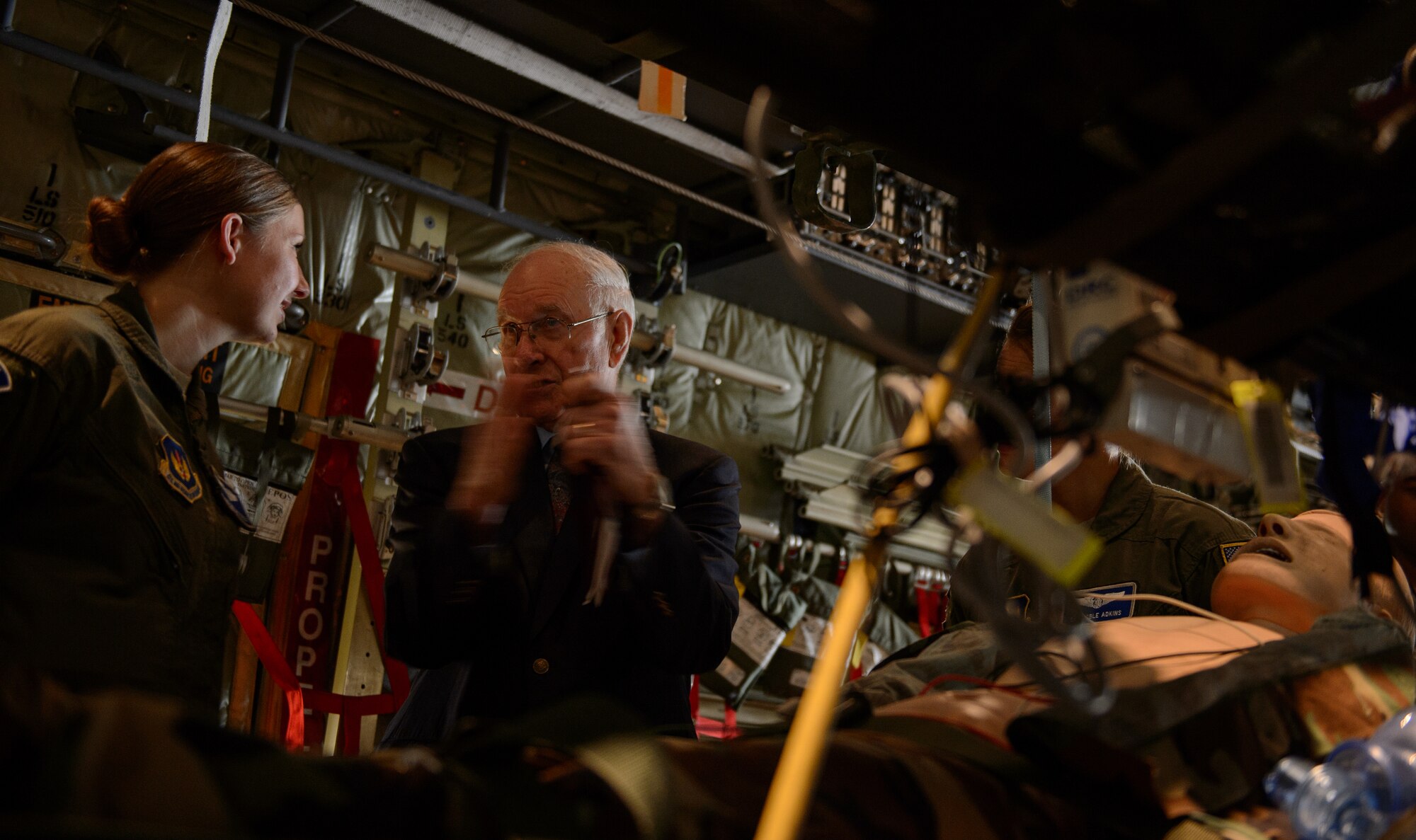 Sam E. Parish, retired Chief Master Sergeant of the Air Force, explains his experiences with medical Airmen as members of the 86th Aeromedical Evacuation Squadron show him their job Jan. 26, 2015, at Ramstein Air Base, Germany. Parish visited the 86th Airlift Wing, 521st Air Mobility Wing and 435th Air Ground Operations Wing to learn about the variety of capabilities of each wing during a base visit. The Airmen of the 86th showed Parish how they generate and employ air mobility enabling theater and strategic airpower by operating a key Air Force power projection platform at Ramstein.  (U.S. Air Force photo/Staff Sgt. Armando A. Schwier-Morales)