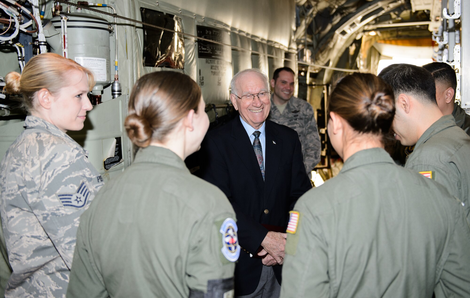 Sam E. Parish, retired Chief Master Sergeant of the Air Force, speaks with Airmen of the 86th Airlift Wing during a base visit Jan. 26, 2015, at Ramstein Air Base, Germany. Prior to guest speaking at the Chiefs Recognition Ceremony at Ramstein, Parish learned about the multiple missions of the 86th AW, 435th Air Ground Operations Wing and 521st Air Mobility Wing. The Airmen of the 86th AW showed Parish how they generate and employ air mobility enabling theater and strategic airpower by operating a key Air Force power projection platform at Ramstein.  (U.S. Air Force photo/Staff Sgt. Armando A. Schwier-Morales)