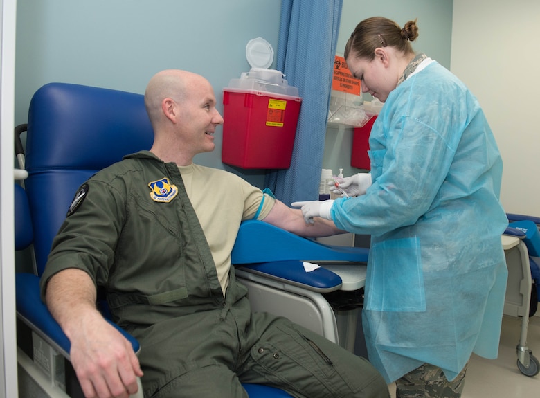 Staff Sgt. Ashley Godward, 66th Medical Squadron Laboratory technician, prepares to take a blood sample from Lt. Col. Richard Howard, C3I and Networks Kill Chain Materiel Solution Analysis chief, at Hanscom Air Force Base, Mass., Jan. 26. Members of the Hanscom clinic observed Biomedical Sciences Corps Appreciation Week Jan. 25 through 29. The week was first established three years ago to recognize officers, enlisted and their civilian counterparts, in the varied BSC specialties. (U.S. Air Force photo by Jerry Saslav)