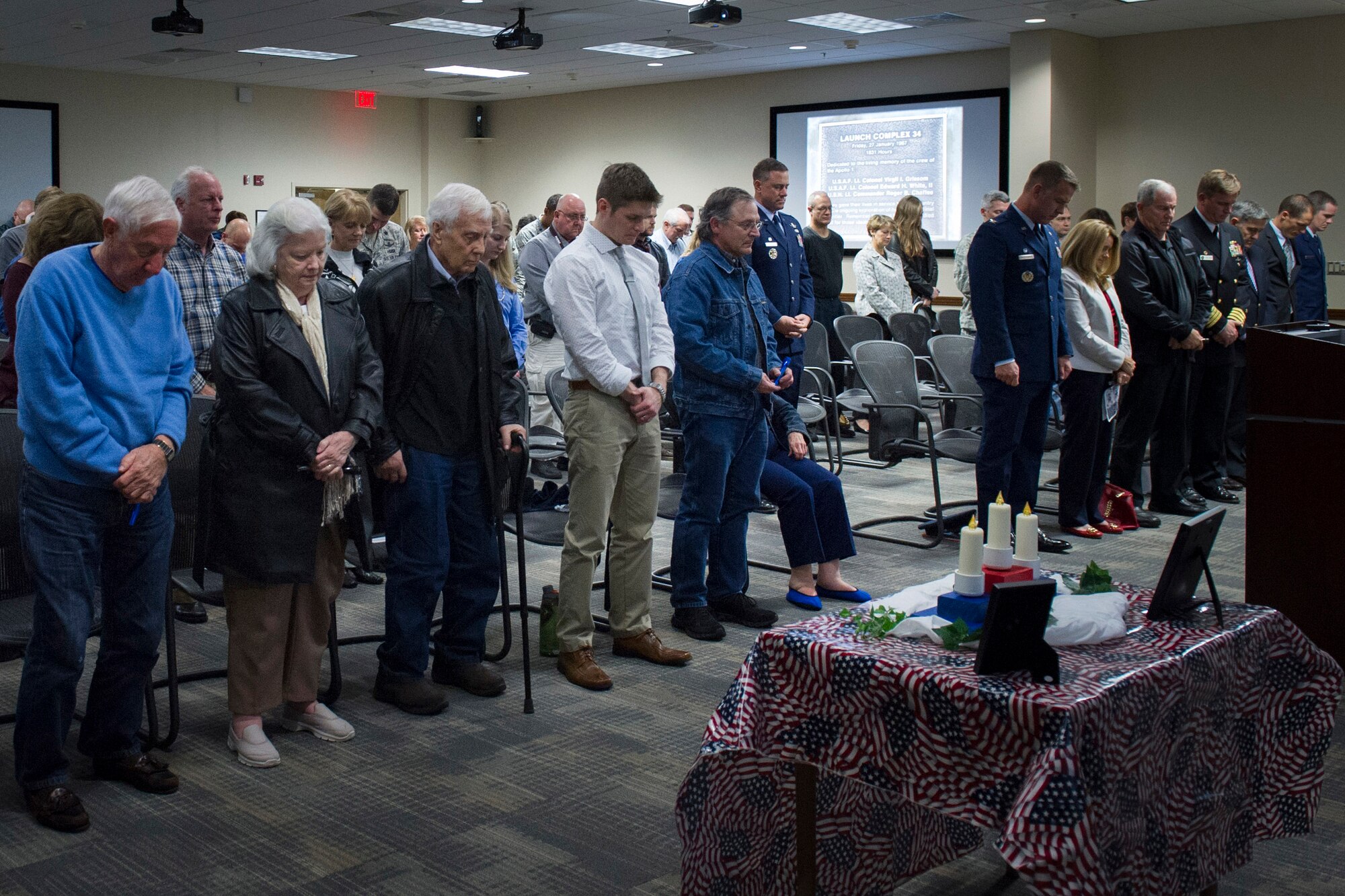 The 45th Space Wing hosted a memorial ceremony honoring the 49th anniversary of the Apollo 1 tragedy Jan. 27, at Cape Canaveral Air Force Station, Fla. The memorial honored crew members, Lt. Col. Virgil I. Gus Grissom, command pilot, Lt. Col. Edward H. White II, senior pilot, and Lt. Commander, Roger B. Chaffee, pilot, who were killed by a flash fire during a launch pad test of their Saturn 1B rocket, Jan. 27, 1967. The memorial ceremony is traditionally held at Space Launch Complex 34, where the accident occurred, but was held indoors due to inclement weather. (U.S. Air Force photo/Matthew Jurgens) (Released) 