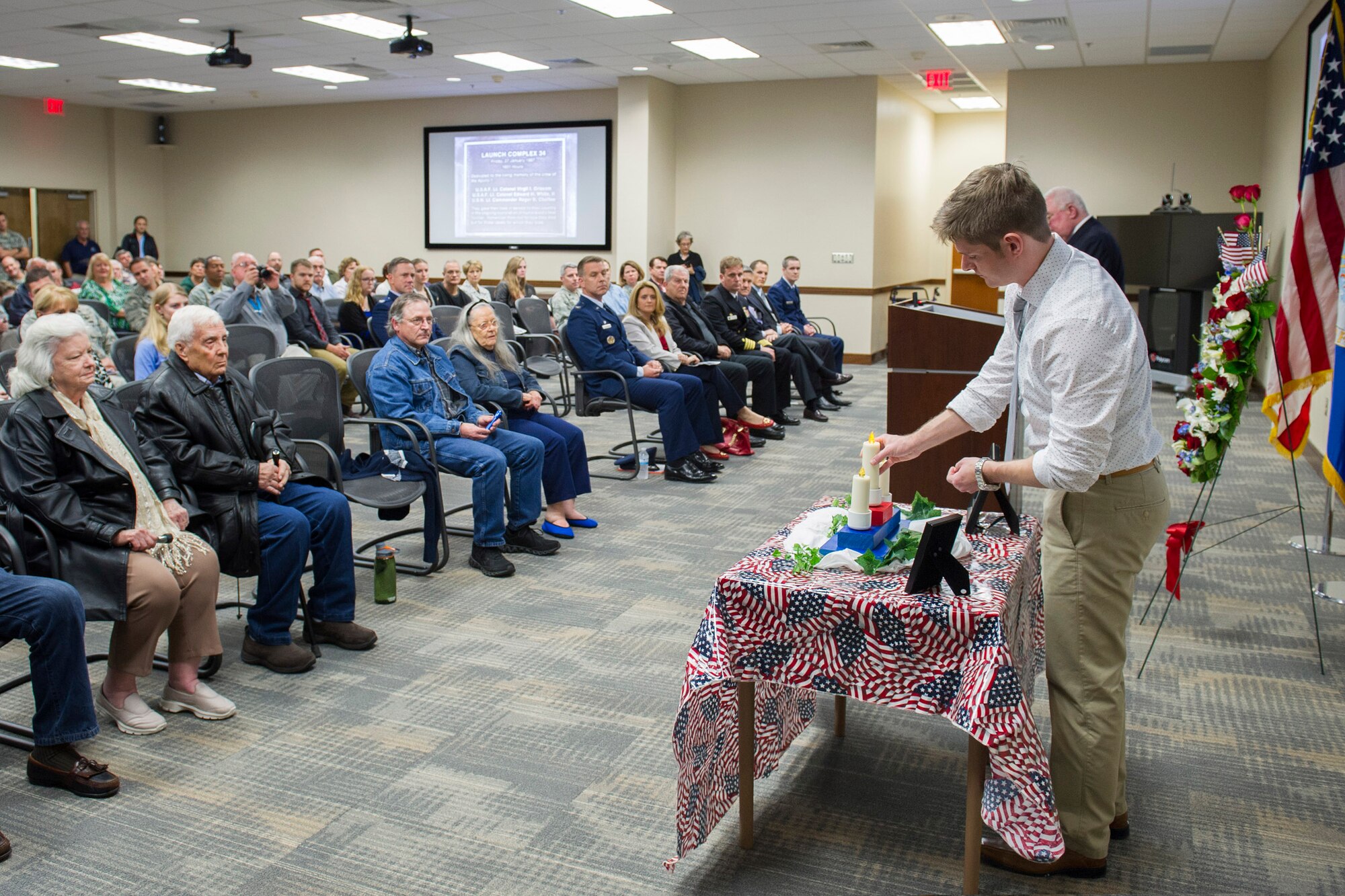 The 45th Space Wing hosted a memorial ceremony honoring the 49th anniversary of the Apollo 1 tragedy Jan. 27, at Cape Canaveral Air Force Station, Fla. The memorial honored crew members, Lt. Col. Virgil I. Gus Grissom, command pilot, Lt. Col. Edward H. White II, senior pilot, and Lt. Commander, Roger B. Chaffee, pilot, who were killed by a flash fire during a launch pad test of their Saturn 1B rocket, Jan. 27, 1967. The memorial ceremony is traditionally held at Space Launch Complex 34, where the accident occurred, but was held indoors due to inclement weather. (U.S. Air Force photo/Matthew Jurgens) (Released) 