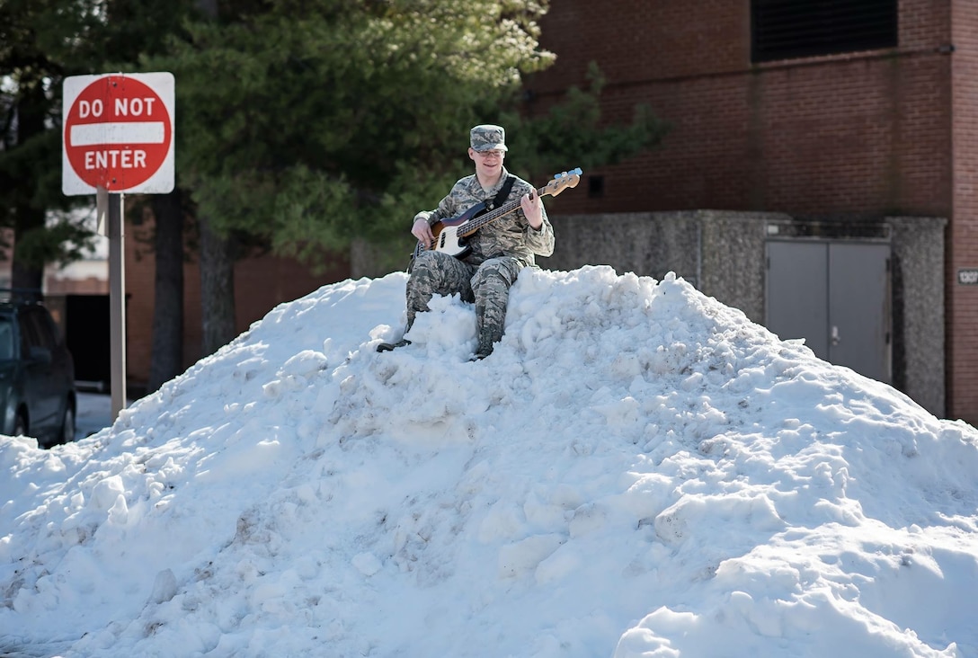 Technical Sergeant Cameron Kayne, bassist for The Airmen of Note, was unmoved by the
recent blizzard and managed to find a place to practice on base.  Flexibility is the key to Airpower! (U.S. Air Force Photo by Senior Master Sgt Kevin Burns/released)
