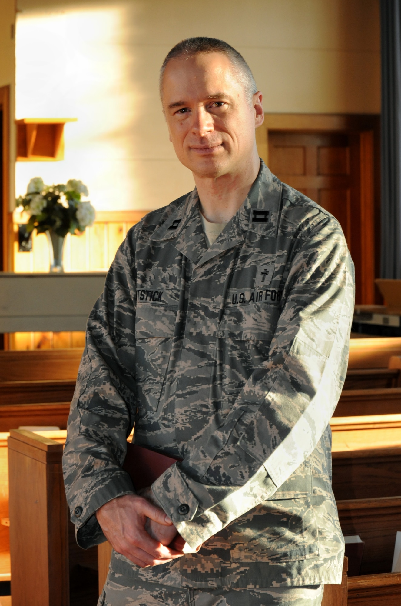 Oregon Air National Guard Chaplain (Capt.) Rory Pitstick, assigned to the 142nd Fighter Wing, pauses for a photograph at the base chapel following Catholic Mass, Jan. 10, 2016. Pitstick is part of the 142nd Fighter Wing’s new emphasis of courses and activities under the Comprehensive Airmen Fitness program, designed to focus on Airmen and their families' physical, social, mental and spiritual wellness. (U.S. Air National Guard photo by Tech. Sgt. John Hughel, 142nd Fighter Wing Public Affairs/released)