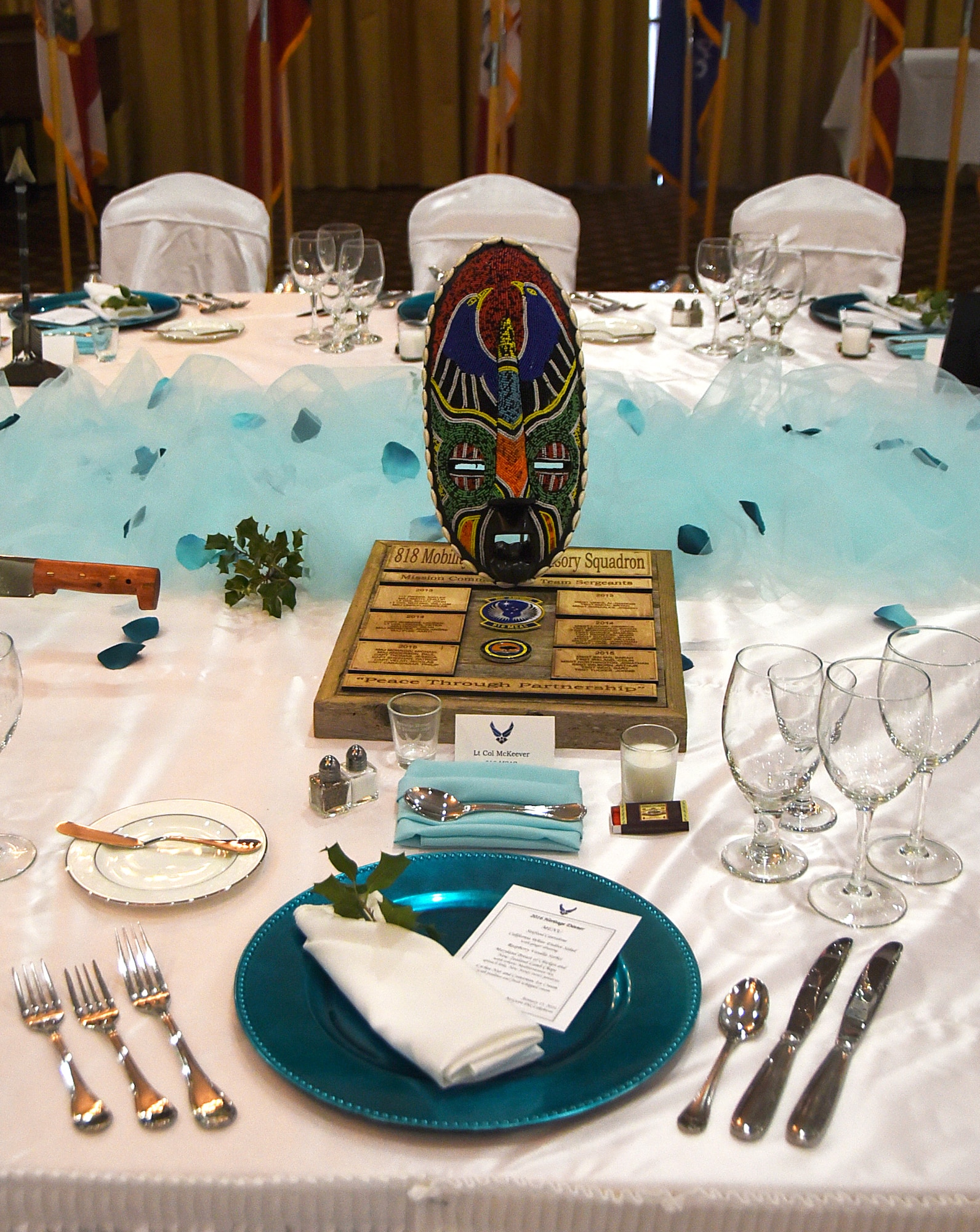 160115-F-CK424-023 The 818th Mobility Support Advisory Squadron heraldic device is placed at a table setting prior to a Heritage Dinner on Jan. 15, 2016, at Joint Base McGuire-Dix-Lakehurst, New Jersey. One of the most important elements of the Heritage Dinner, the heraldic device represents the past, present and future missions of a specific command. (U.S. Air Force photo/Tech. Sgt. Jamie Powell)