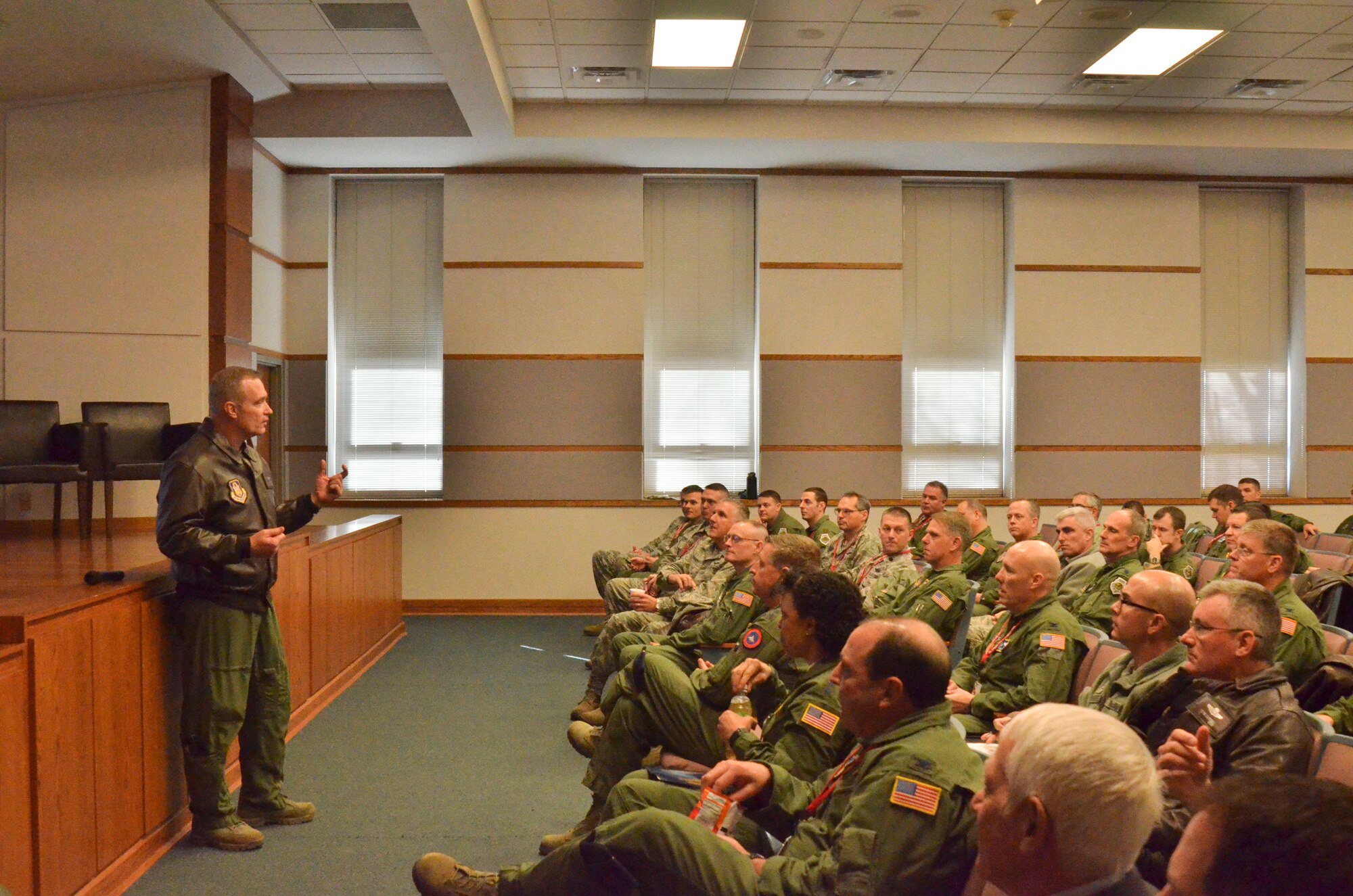 U.S. Air Force Col. Bobby Oates, commander of the Advanced Airlift Tactics Training Center, speaks to guests at the center’s 34th annual symposium at Rosecrans Air National Guard Base, St. Joseph, Mo., Jan. 28, 2015. Over 300 Airmen who specialize in airlift tactics from the regular Air Force, Air Force Reserves, and Air National Guard attended the symposium. (U.S. Air National Guard photo by Tech. Sgt. Erin Hickok/Released)