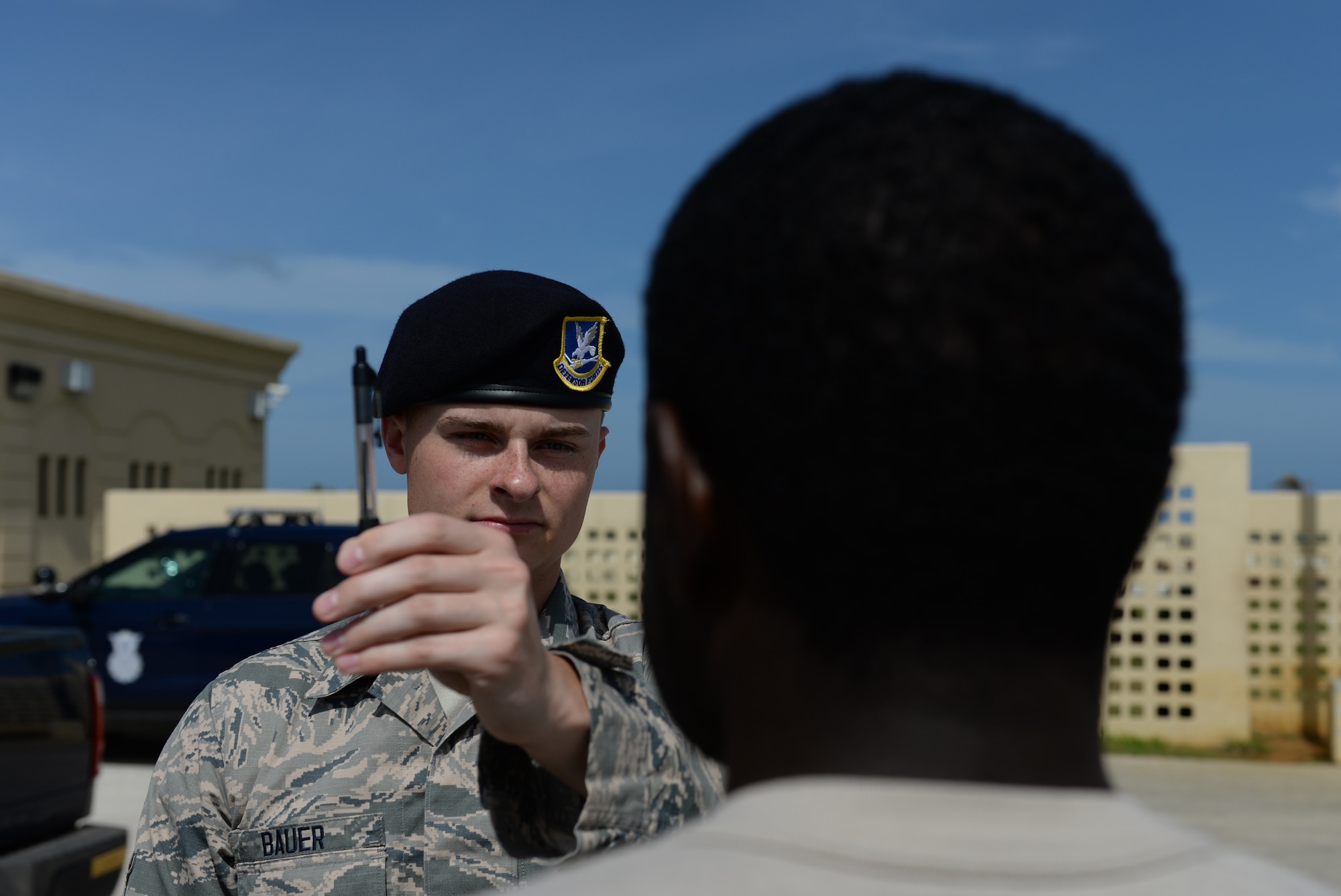 Airman Austin Bauer, 36th Security Forces Squadron, left, conducts a horizontal gaze nystagmus test during field sobriety test training Jan. 29, 2016, at Andersen Air Force Base, Guam. Security Forces members practiced conducting sobriety tests to include the one-leg stand, walk and turn, and horizontal gaze nystagmus test as part of their field sobriety test training. (U.S. Air Force photo/Airman 1st Class Jacob Skovo)