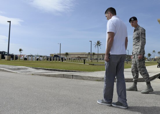 Airman Austin Bauer, 36th Security Forces Squadron, right, watches a volunteer perform a walk and turn test during field sobriety test training Jan. 29, 2016, at Andersen Air Force Base, Guam. This test challenges an individual's short-term memory, balance and motor skills, which are needed for safe operation of a vehicle. (U.S. Air Force photo/Airman 1st Class Jacob Skovo)