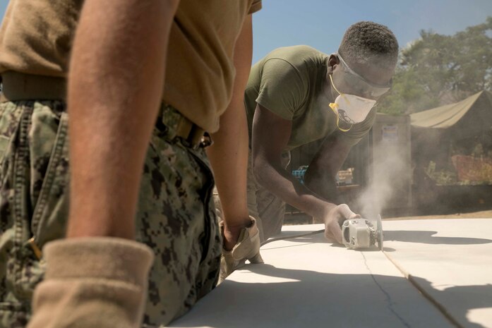 U.S. Marine Lance Cpl. Jamar L. Griffin, from Columbia, South Carolina, cuts drywall during exercise Harii Hamutuk 2015, at the Port Hera Naval Base in Hera, Timor Leste, Oct. 29, 2015. HH15 allows units from multiple countries, like Australia, Japan, and the U.S., to share and improve upon current practices in skill areas like engineering. Griffin is a combat engineer with 9th Engineer Support Battalion, 3rd Marine Logistics Group, III Marine Expeditionary Force. (U.S. Marine Corps photo by Lance Cpl. Cedric R. Haller II/Released)