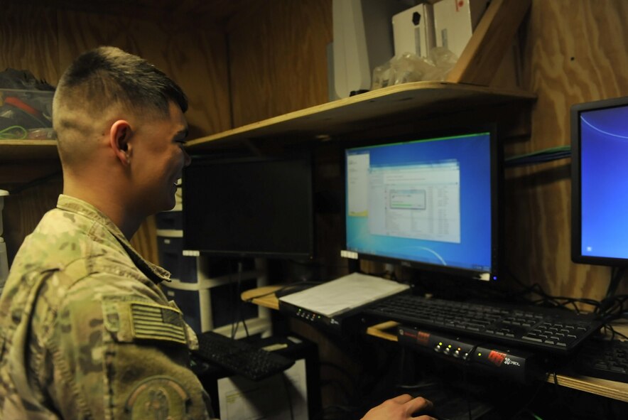 Senior Airman Andrew Dawson, 455th Expeditionary Communications Squadron Client Systems technician, updates a computer system before it is return to the cyber network at Bagram Airfield, Afghanistan, on Jan. 13, 2016. The 455th Network Operations and Client Systems sections have the critical responsibility of ensuring that the systems required for command and control, accountability, and more are functioning properly and are adequately protected from cyber threats. (U.S. Air Force photo by Tech. Sgt. Nicholas Rau)