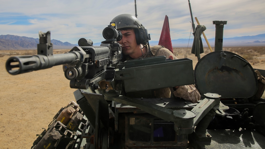Sgt. Tyler Felts, an LAV crewman, sights in on a target during a live-fire gunnery qualification test with an M240B machine gun at Marine Corps Air Ground Combat Center Twentynine Palms,California, Jan. 22, 2016. Live-fire tests like these allow the Marines of 1st Light Armored Reconnaissance Battalion, 1st Marine Division, I Marine Expeditionary Force to train for how they will execute their mission when they are deployed in a combat zone. 
