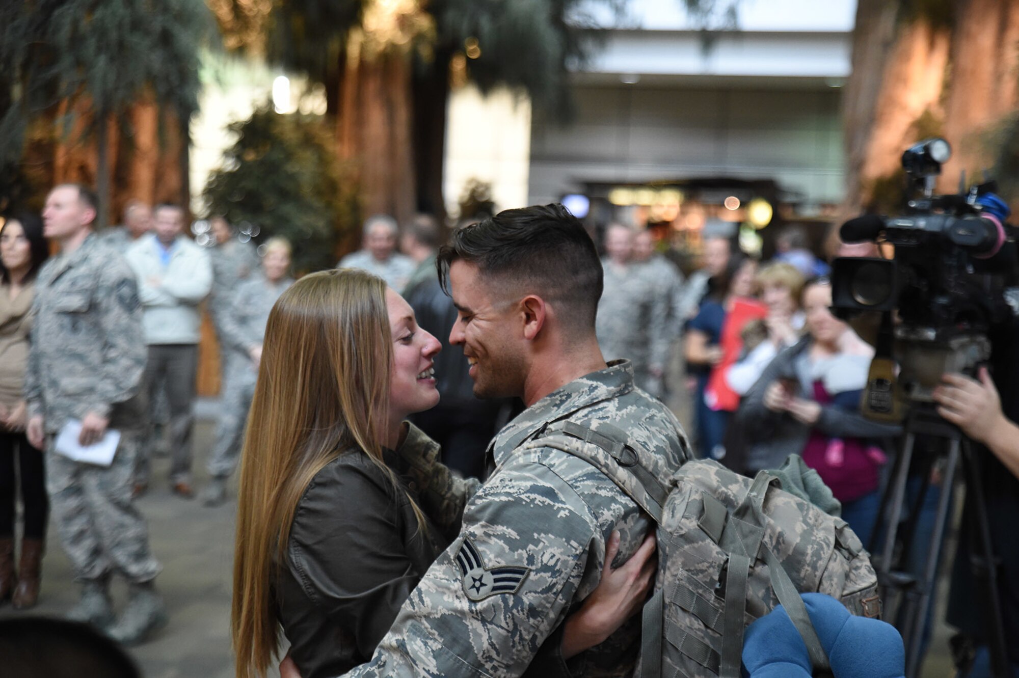 Senior Airman Christopher Gonzales, of the 144th Security Forces Squadron, is welcomed home by Megan Woodby at the Fresno Yosemite International Airport, Calif., Jan. 21, 2016. Gonzales was deployed for more than seven months in support of Operation Freedom’s Sentinel. (U.S. Air National Guard photo/Senior Master Sgt. Chris Drudge)