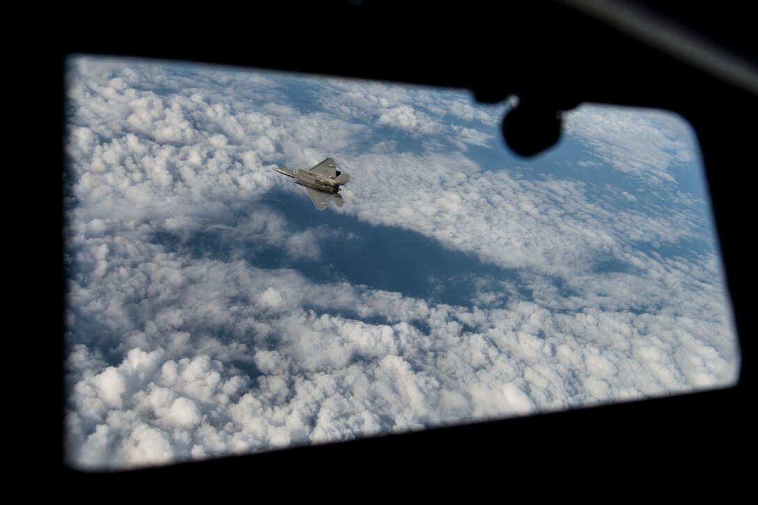 An Air Force F-22 Raptor flies over the Arabian Sea in support of Operation Inherent Resolve, Jan. 27, 2016. The F-22 is a fifth-generation aircraft and is designed to engage in air-to-air and air-to-ground missions. Air Force photo by Staff Sgt. Corey Hook