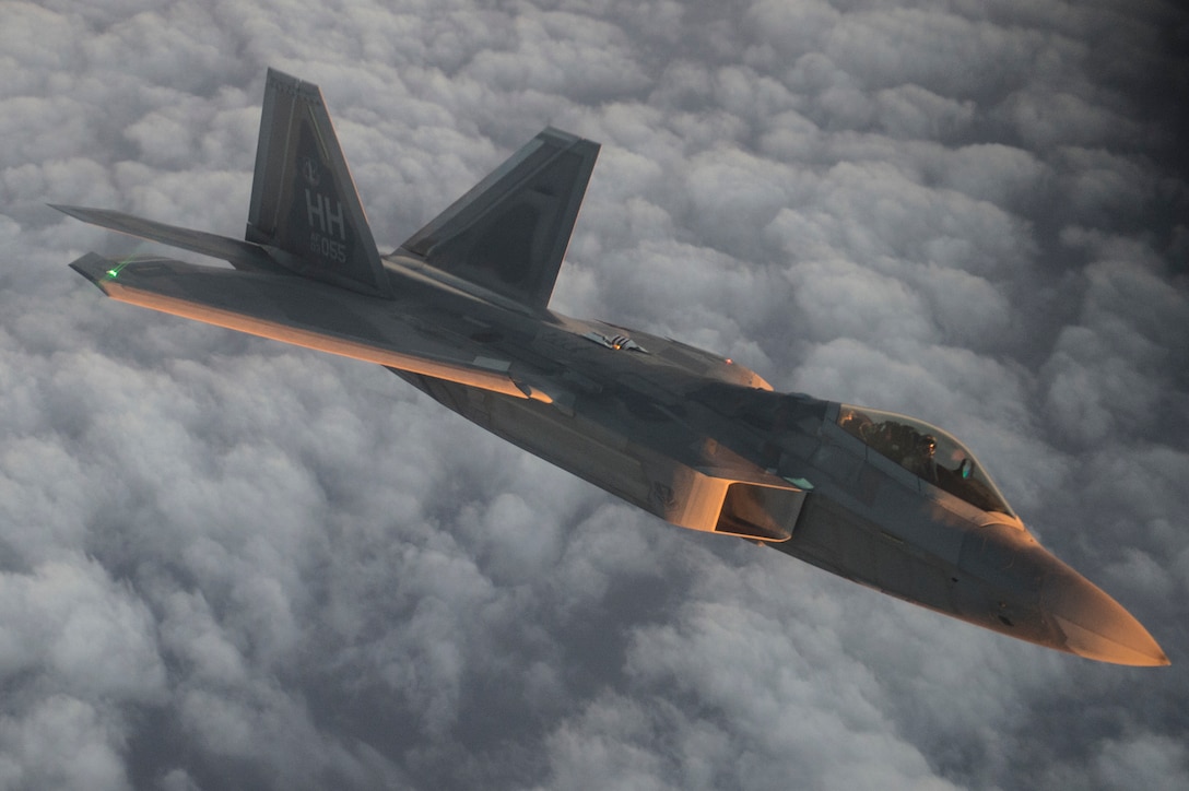 An Air Force F-22 Raptor flies over the Arabian Sea in support of Operation Inherent Resolve, Jan. 27, 2016. Air Force photo by Staff Sgt. Corey Hook
