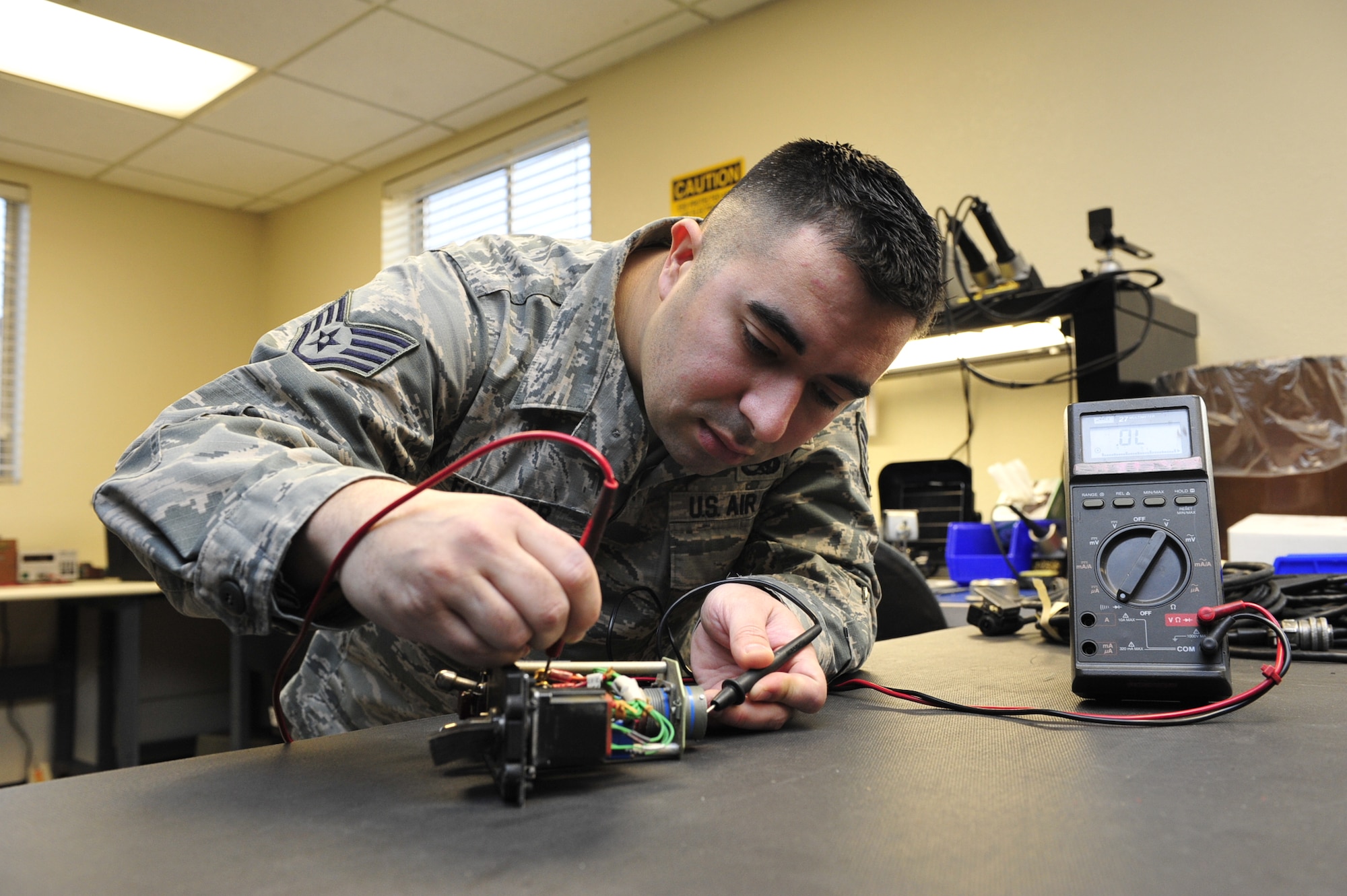 Staff Sgt. Daniel Fournier, 56th Equipment Maintenance Squadron Air Force Repair Enhancement Program technician, checks the continuity of the pins on the fuel master switch Jan. 19 using a multimeter at Luke Air Force Base. Luke AFREP technicians repair a variety of items from wiring harnesses, aircraft electronics, communication cables, headsets, aircraft panels to ground support equipment electronics and more.
