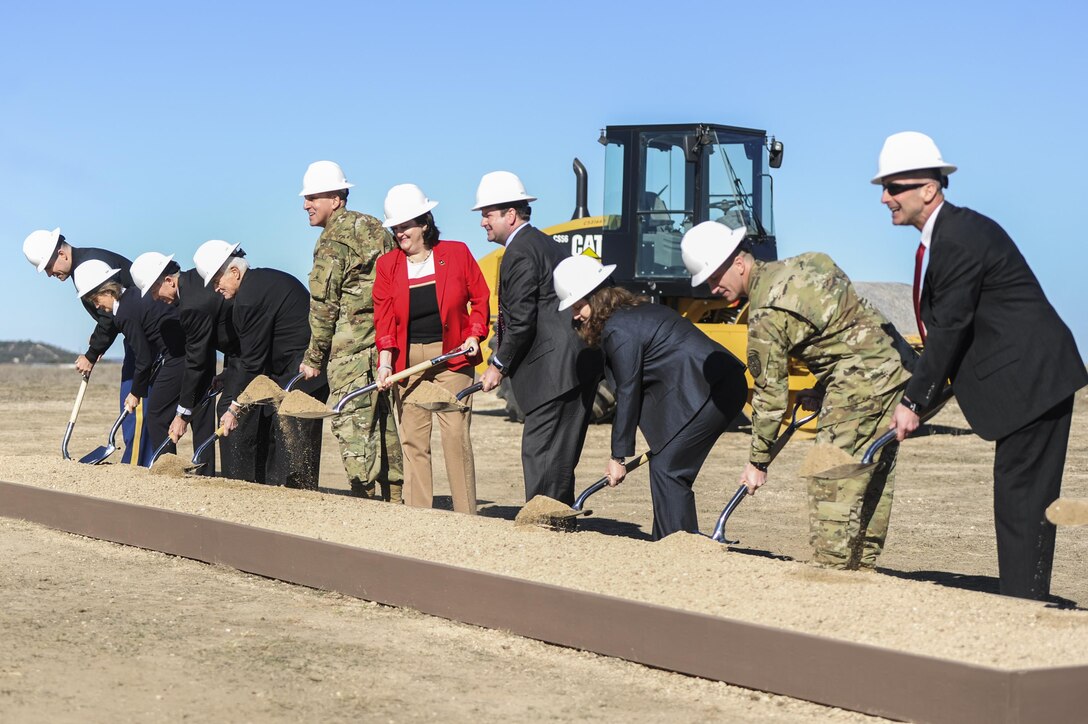 Defense Logistics Agency Energy Installation Energy Director Pam Griffith, second from far left, and other stakeholders break ground on the Army’s first-ever hybrid solar and wind energy project at Fort Hood, Texas, Jan. 28. DLA Energy supported the Army’s renewable energy goals through a contract awarded Jan. 15.