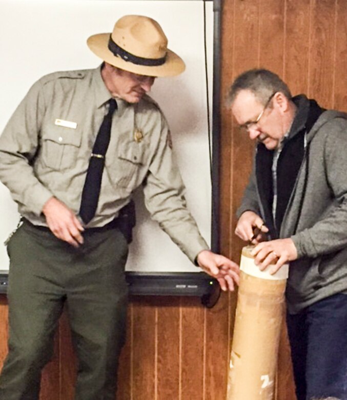 Rodney Daum (left), Tionesta Lake resource manager, and William Alex, a former Tionesta Lake resource manager, opened and inventoried a 1991 time capsule.