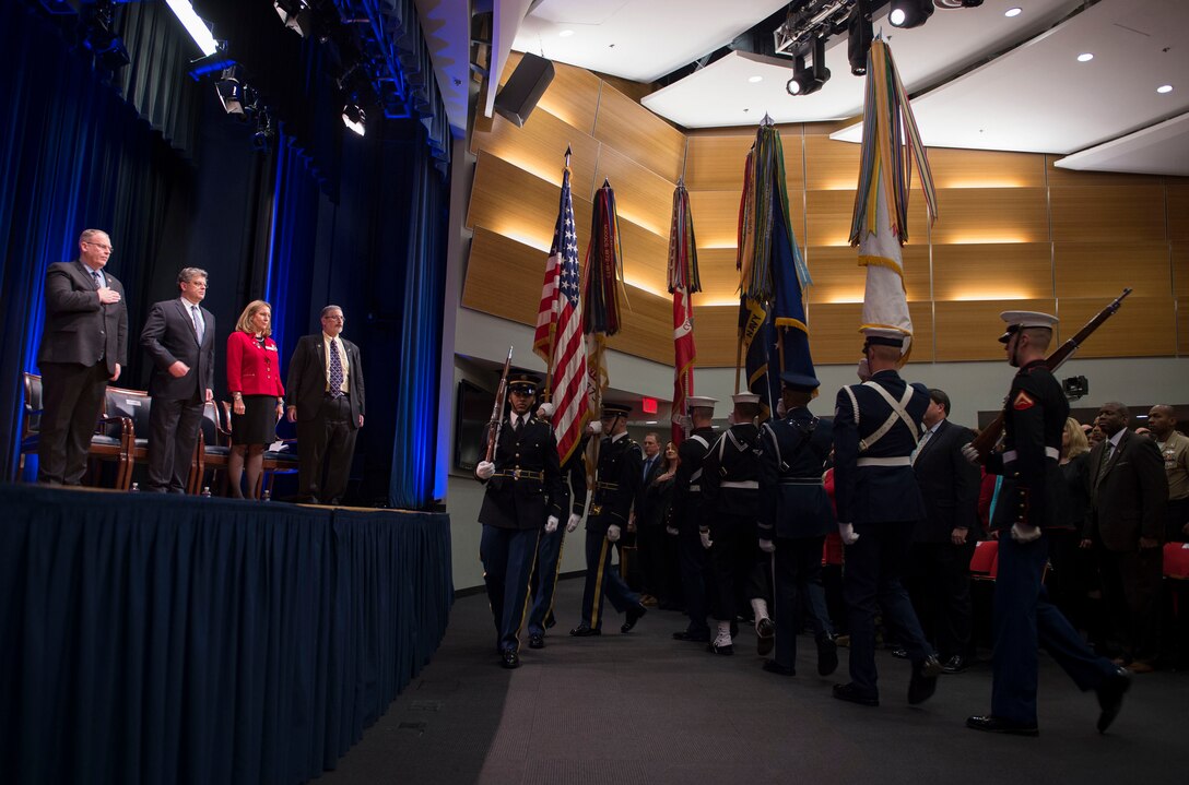 Deputy Defense Secretary Bob Work, left, observes the parading of the colors at the Combined Federal Campaign awards ceremony at the Pentagon, Jan. 28, 2016. The campaign is the world's largest annual workplace charity effort, raising millions of dollars to provide health and human service benefits. DoD photo by Navy Petty Officer 1st Class Tim D. Godbee