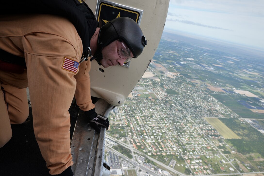 A member of the Army's Golden Knights demonstration team checks for clearance over the drop zone before conducting a training jump over Homestead Air Reserve Base, Fla., Jan. 21, 2016. New York Air National Guard photo by Staff Sgt. Christopher S. Muncy