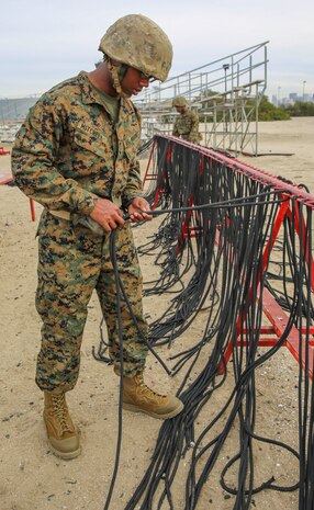Private Toosaint P. Mitchell (right), Lima Company, 3rd Recruit Training Battalion, grabs a rappel rope during the rappel tower event at Marine Corps Recruit Depot San Diego, Jan. 22. Drill instructors taught the recruits how to properly fasten the ropes prior to participating in the event. Annually, more than 17,000 males recruited from the Western Recruiting Region are trained at MCRD San Diego.