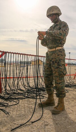 Private Toosaint P. Mitchell, Lima Company, 3rd Recruit Training Battalion, attaches a rappel rope to himself during the rappel tower event at Marine Corps Recruit Depot San Diego, Jan. 22. Drill instructors taught the recruits how to properly fasten the ropes prior to participating in the event. Mitchell is afraid of heights, but he managed to complete the event along with the other recruits. Annually, more than 17,000 males recruited from the Western Recruiting Region are trained at MCRD San Diego.