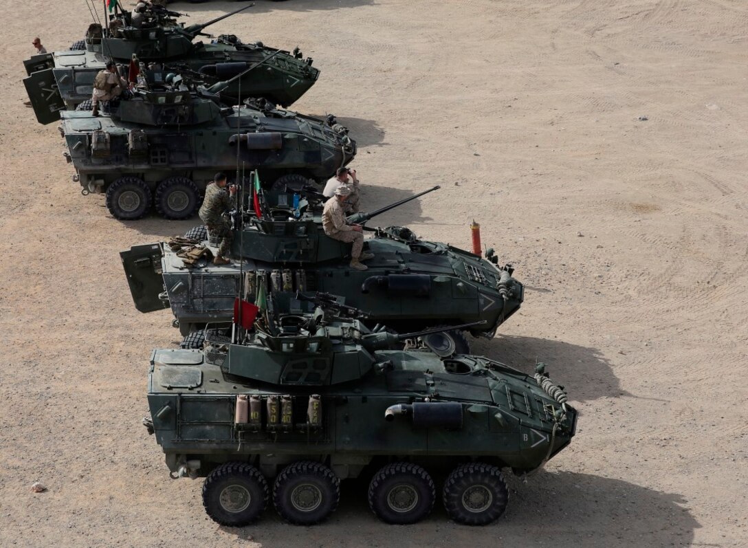 Light Armored Vehicles are staged for a live-fire gunnery qualification test at Marine Corps Air Ground Combat Center Twentynine Palms, Jan. 22, 2016. Live-fire tests like these allow the Marines of 1st Light Armored Reconnaissance Battalion, 1st Marine Division, I Marine Expeditionary Force to train for how they will execute their mission when they are deployed in real-world operations. (U.S. Marine Corps photo by Pvt. Robert Bliss)