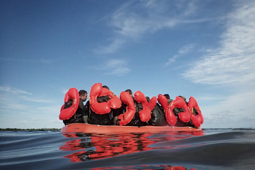 Airmen in a raft participate in water survival training near Homestead Air Reserve Base, Fla., Jan. 20, 2016. New York Air National Guard photo by Staff Sgt. Christopher S. Muncy 