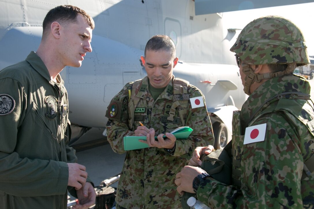 U.S. Marine SSgt. John Logan, MV-22 Osprey Crew Chief, gives stats of the MV-22 Osprey to Japan Ground Self-Defense Force (JGSDF) soldiers during Exercise Iron Fist 2016 aboard Marine Corps Base Camp Pendleton, Calif., Jan. 26. This type of progressive training is beneficial for both services as the Japan Ground Self-Defense Force develops their Amphibious Rapid Deployment Brigade by 2018. (U.S. Marine Corps photo by Lance Cpl. Brandon Maldonado/ Released)